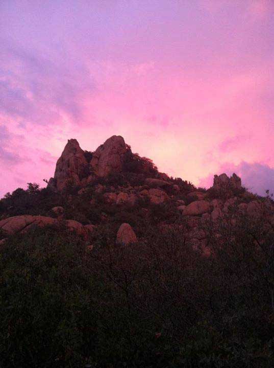Large Rock Formation Silhouettes with Purple Sunset